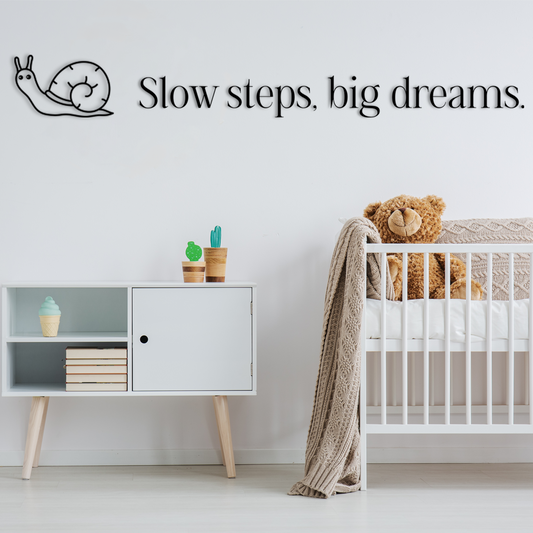 Charming wall decor featuring small illustration of a snail paired with the inspiring phrase “Slow steps, big dreams,”. Acrylic glass decor - Vibewall