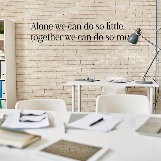 Office setting with motivational quote on wall, desk, and lamp. Acrylic wall decor - Vibewall
