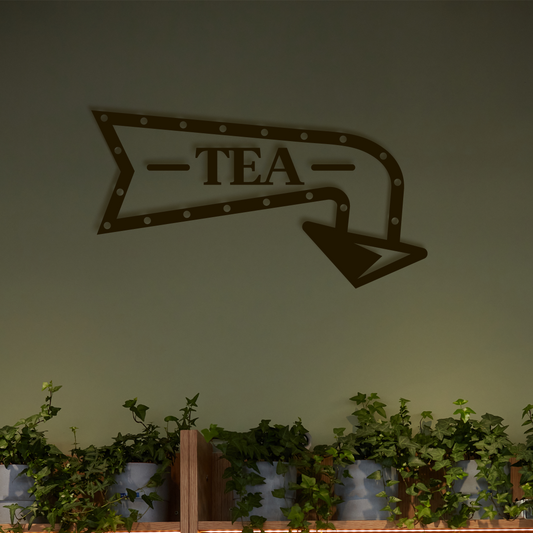 Decorative wall sign with 'TEA' on an arrow, above a row of potted plants. Acrylic wall decor - Vibewall