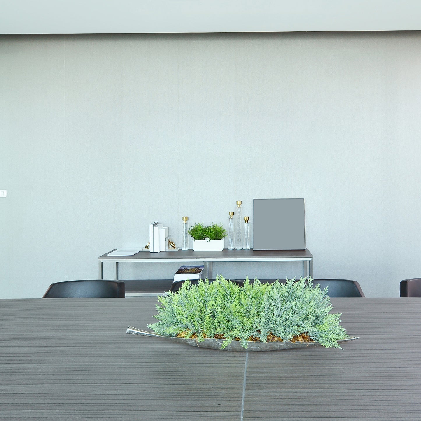 Modern conference room with a table, chairs, and decorative plants. background - Vibewall