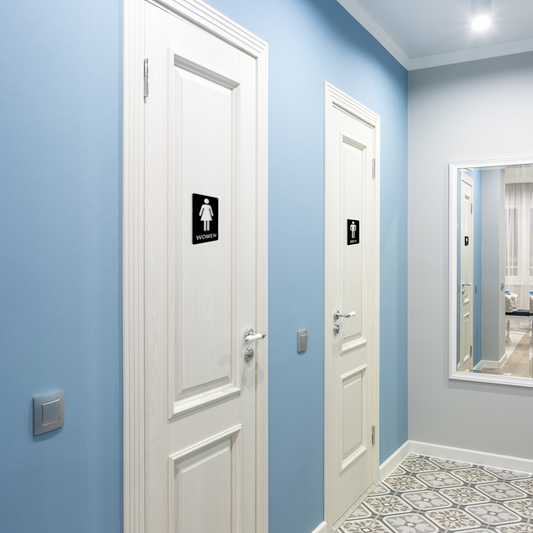 Two white doors in a hallway with blue walls and a mirror on the right. Acrylic glass wall decor - Vibewall