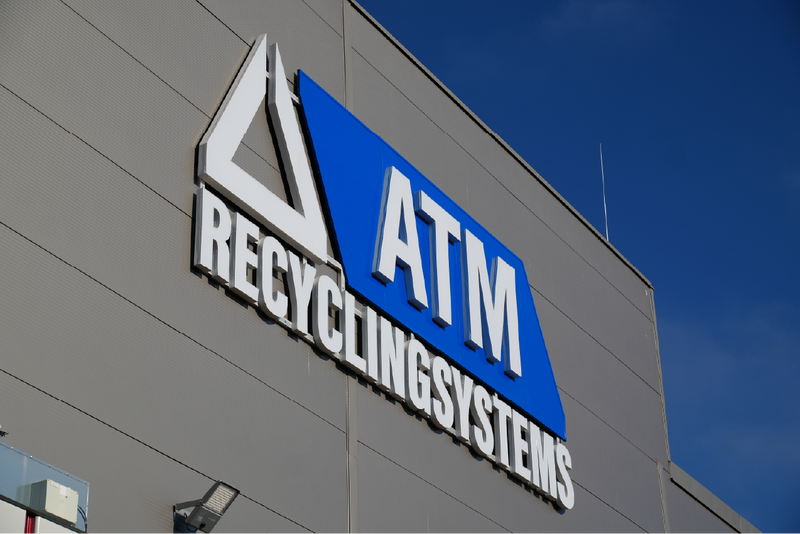 ATM Recyclingsystems logo on a building facade.