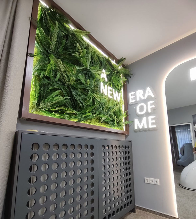 Modern interior design with a green wall feature and motivational quote.