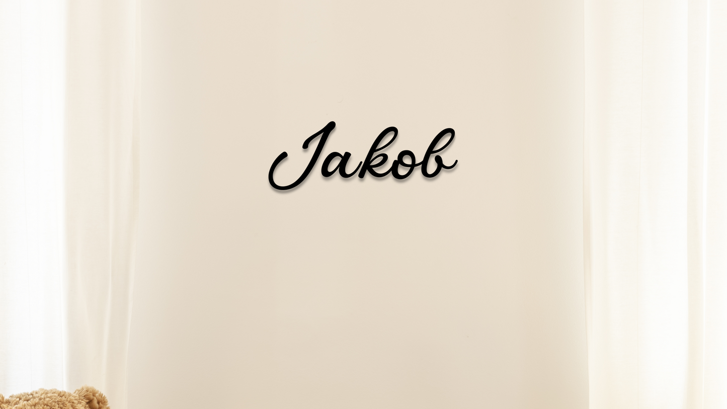 Name 'Jakob' in black text on a beige background - Acrylic wall dekor - Vibewall