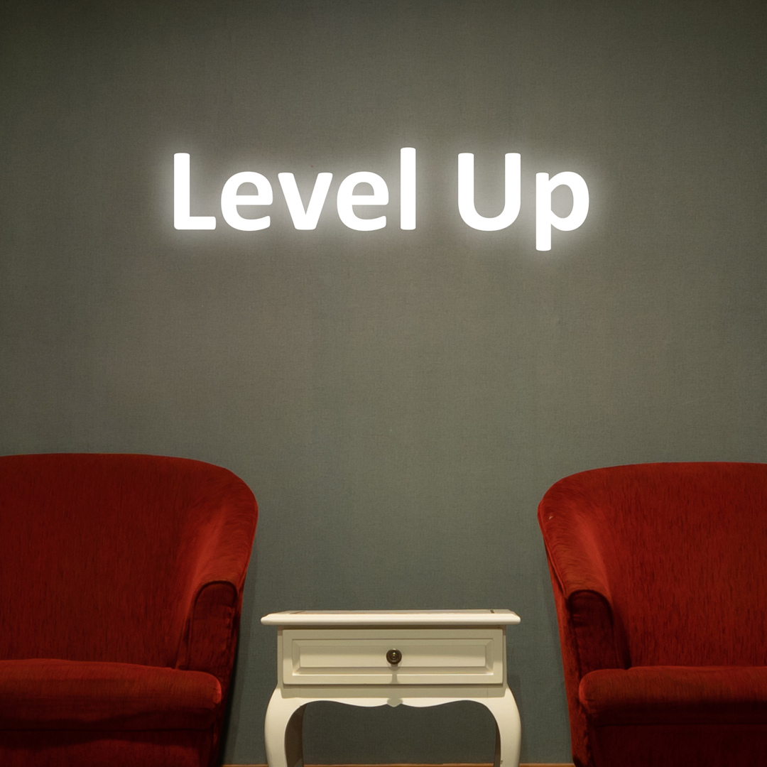 Stylish “Level Up” illuminated wall decor to fuel your gaming spirit. - Vibewall