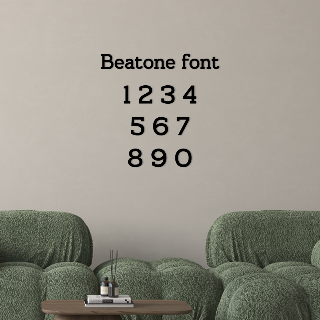 Green sofa with a small wooden table and decorative items against a beige wall with 'Beatone font' text. Acrylic wall decor - Vibewall