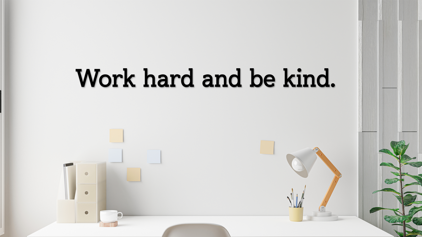 Motivational quote 'Work hard and be kind' on a white wall with a desk and decor. Acrylic wall decor - Vibewall