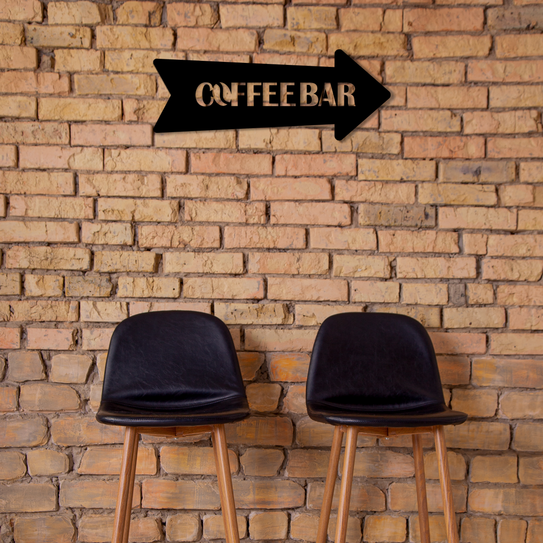 Two black stools in front of a brick wall with a 'Coffee Bar' sign. Acrylic wall decor - Vibewall 