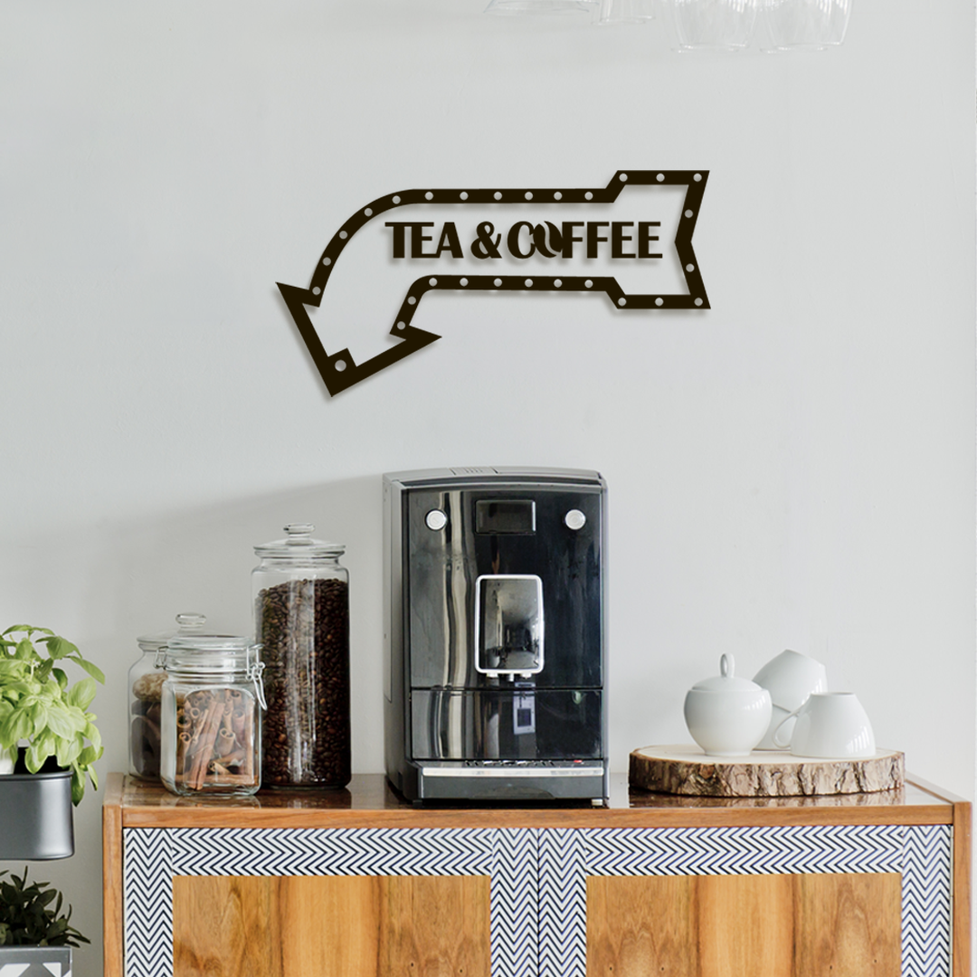 Decorative wall sign with 'Tea & Coffee' text above a coffee machine on a wooden cabinet. Acryclic glass wall decor - Vibewall