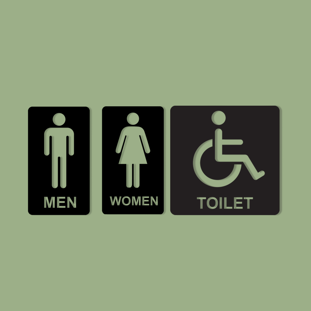 Three bathroom signs indicating 'Men', 'Women', and 'Toilet' with accessibility icon on a green background. Acrylic wall decor - Vibewall