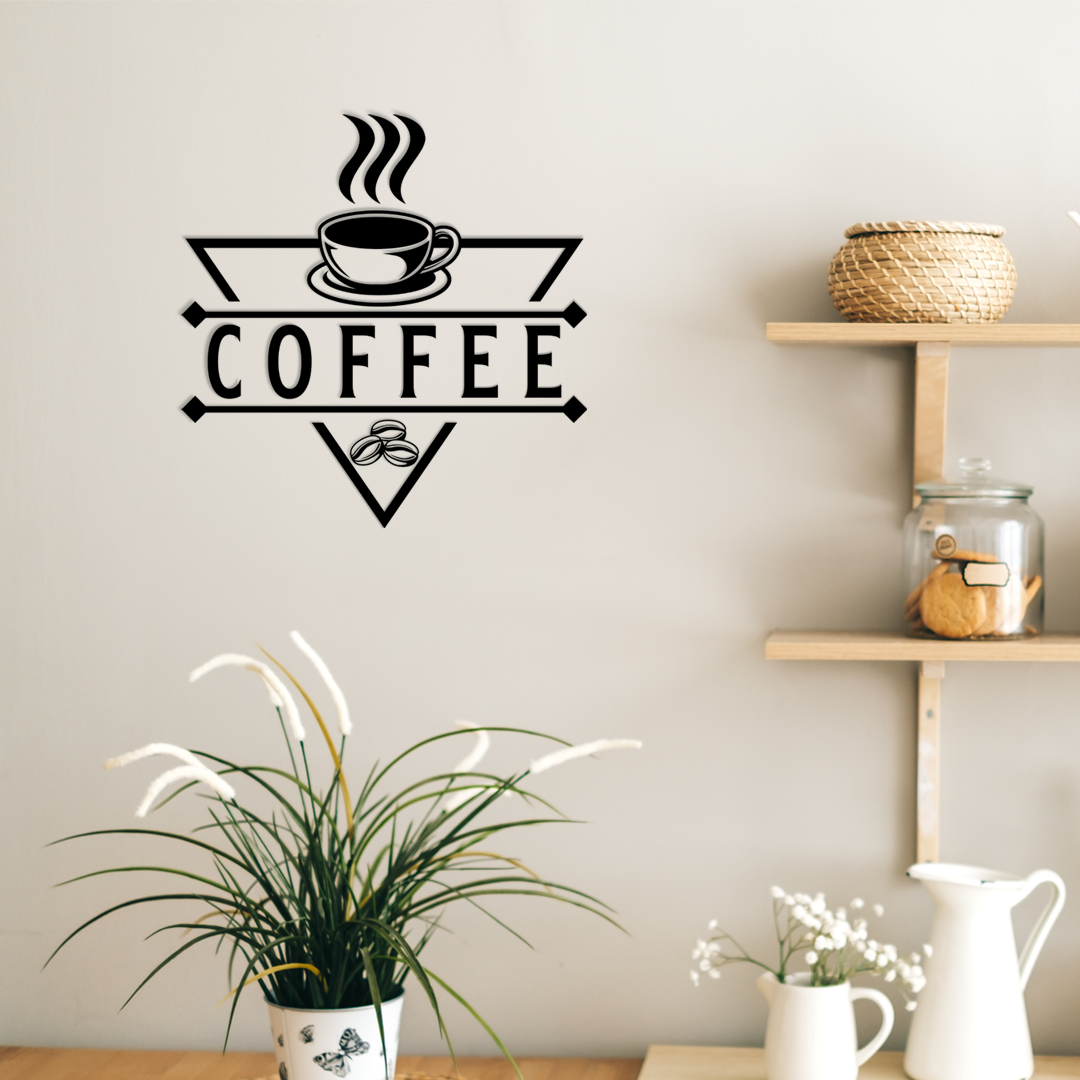 Decorative wall sticker with 'COFFEE' text and cup design on a wall above a shelf with decorative items. Acrylic wall decor - Vibewall 